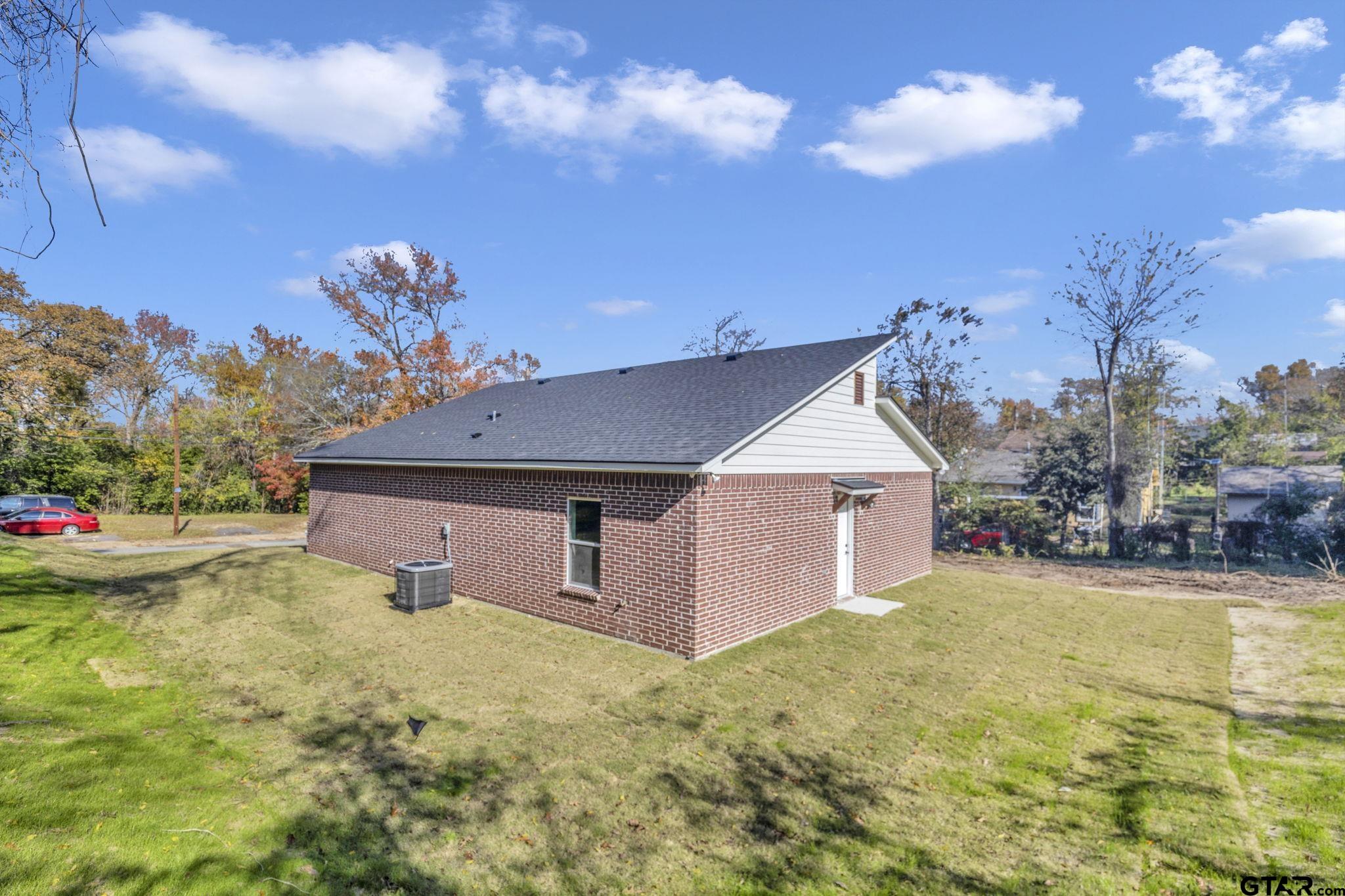 1410 West Connally Street Tyler, TX 75701 - Photo 25 of 29 a front view of a house with garden