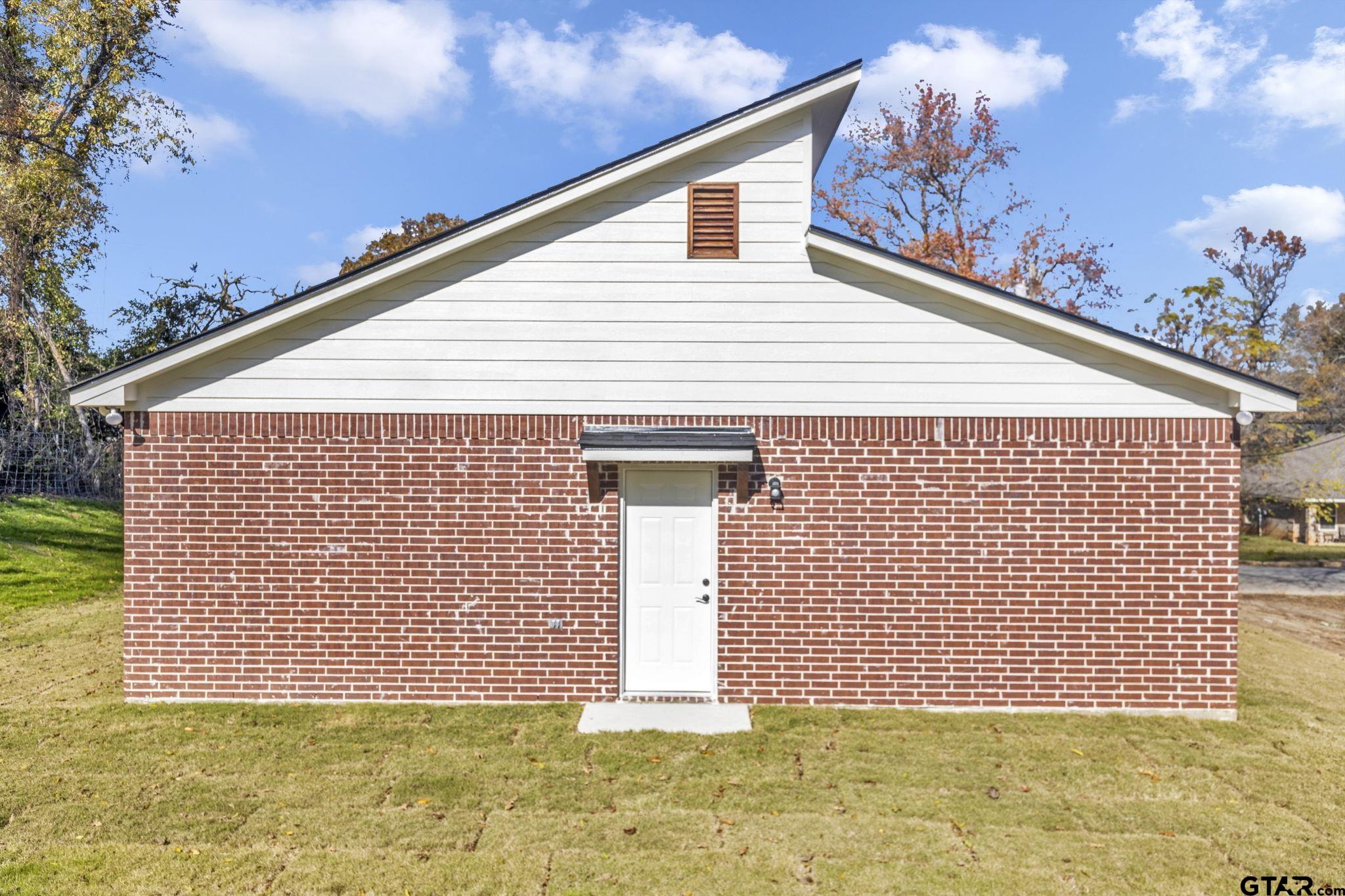 1410 West Connally Street Tyler, TX 75701 - Photo 26 of 29 a front view of a house with a yard