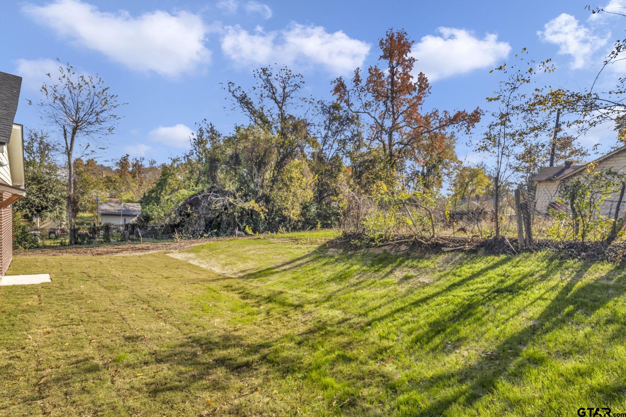 1410 West Connally Street Tyler, TX 75701 - Photo 28 of 29 a view of swimming pool of water with yard and seating area