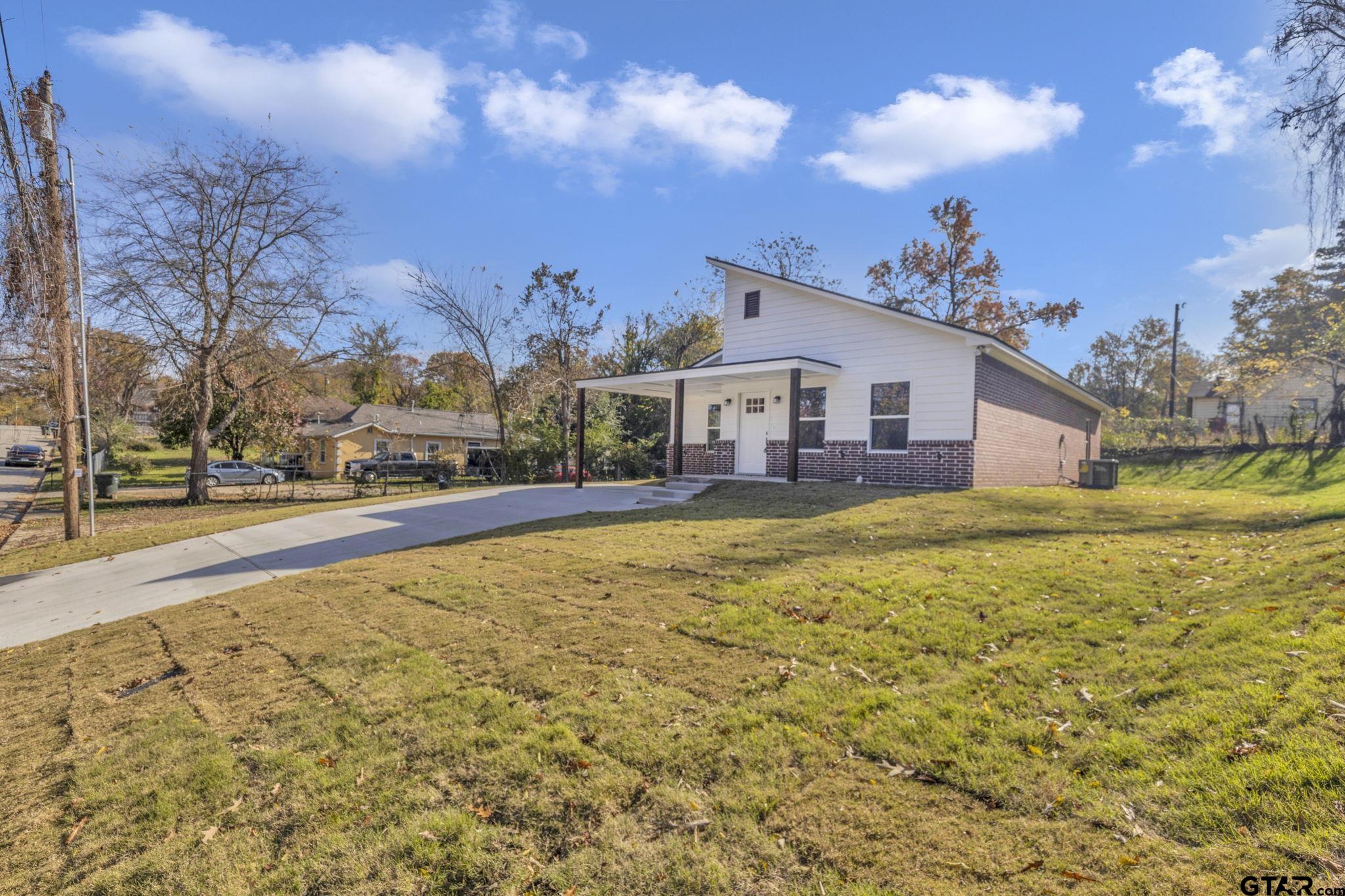 1410 West Connally Street Tyler, TX 75701 - Photo 3 of 29 a house view with swimming pool in front of it