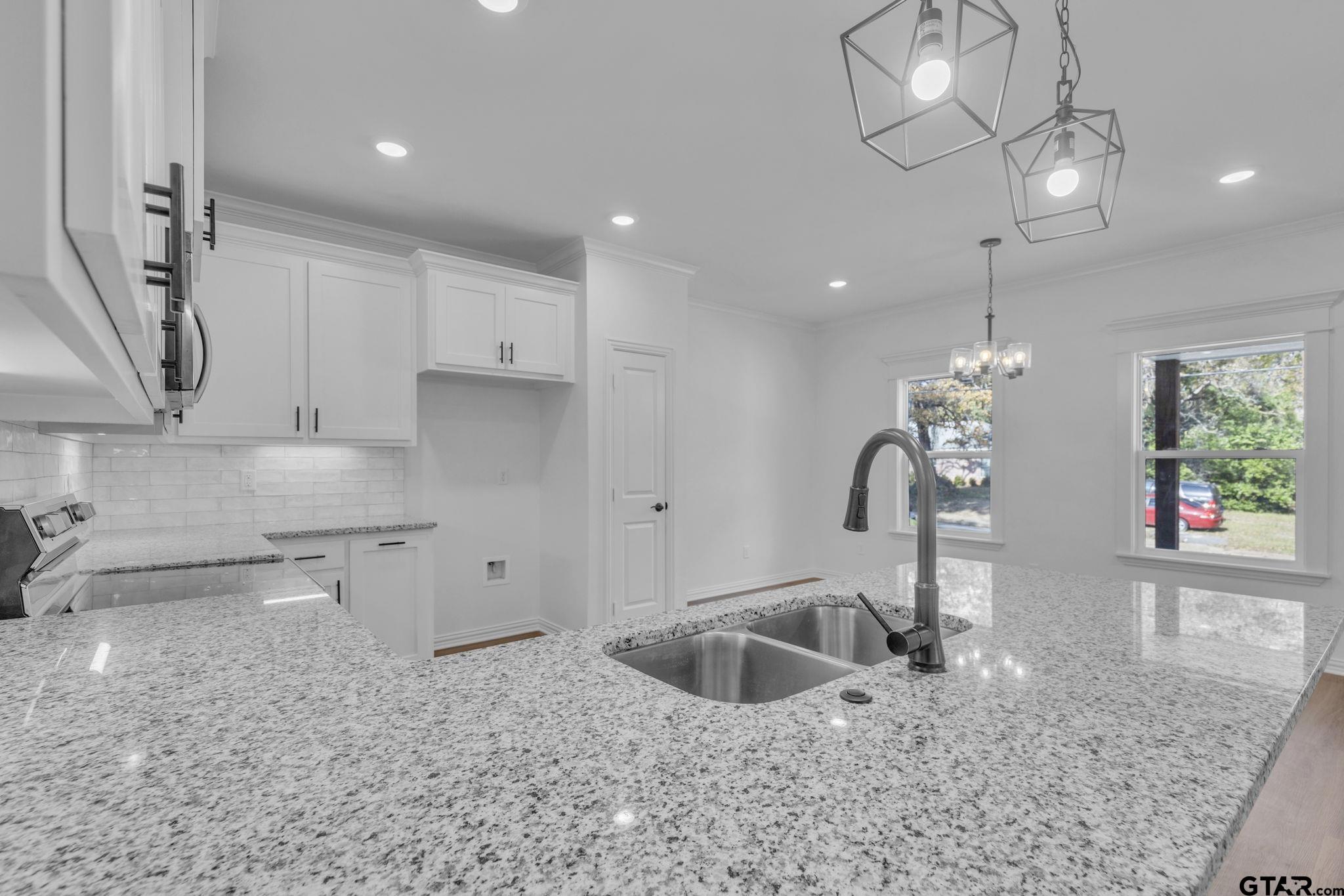 1410 West Connally Street Tyler, TX 75701 - Photo 9 of 29 a kitchen with stainless steel appliances granite countertop a sink a stove and a granite counter tops