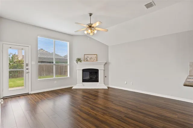 a kitchen with a sink a counter and cabinets
