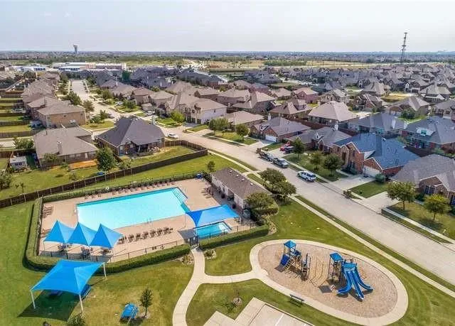 an aerial view of a house with a ocean view