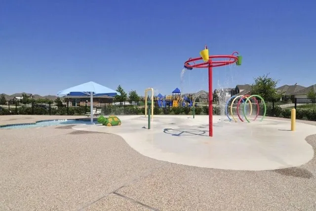 a view of yard with swimming pool and furniture