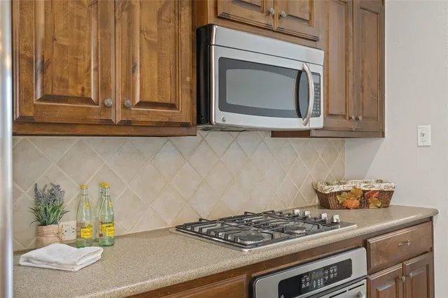 a kitchen with a stove and a microwave