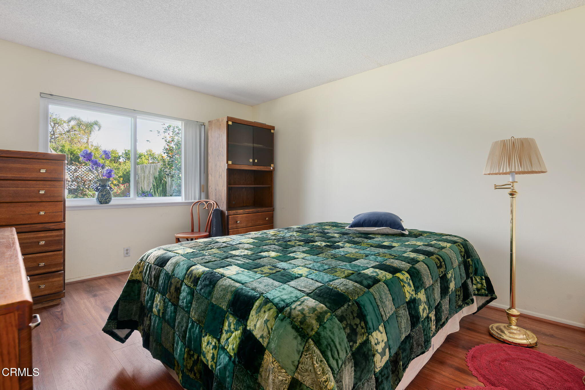 1126 Lawrence Way Oxnard, CA 93035 - Photo 12 of 16 a bedroom with a bed and a window
