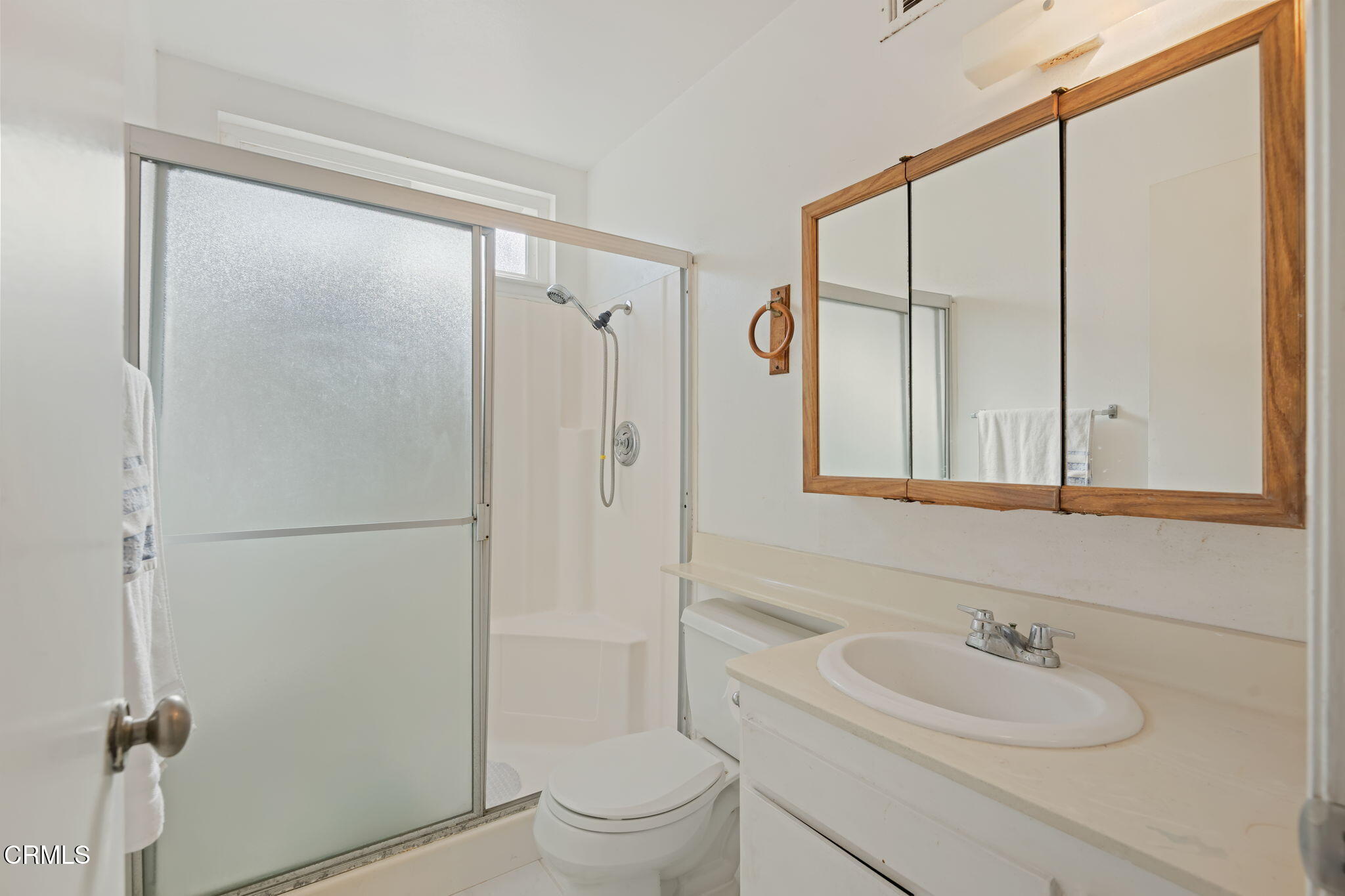 1126 Lawrence Way Oxnard, CA 93035 - Photo 13 of 16 a bathroom with a sink a toilet and shower