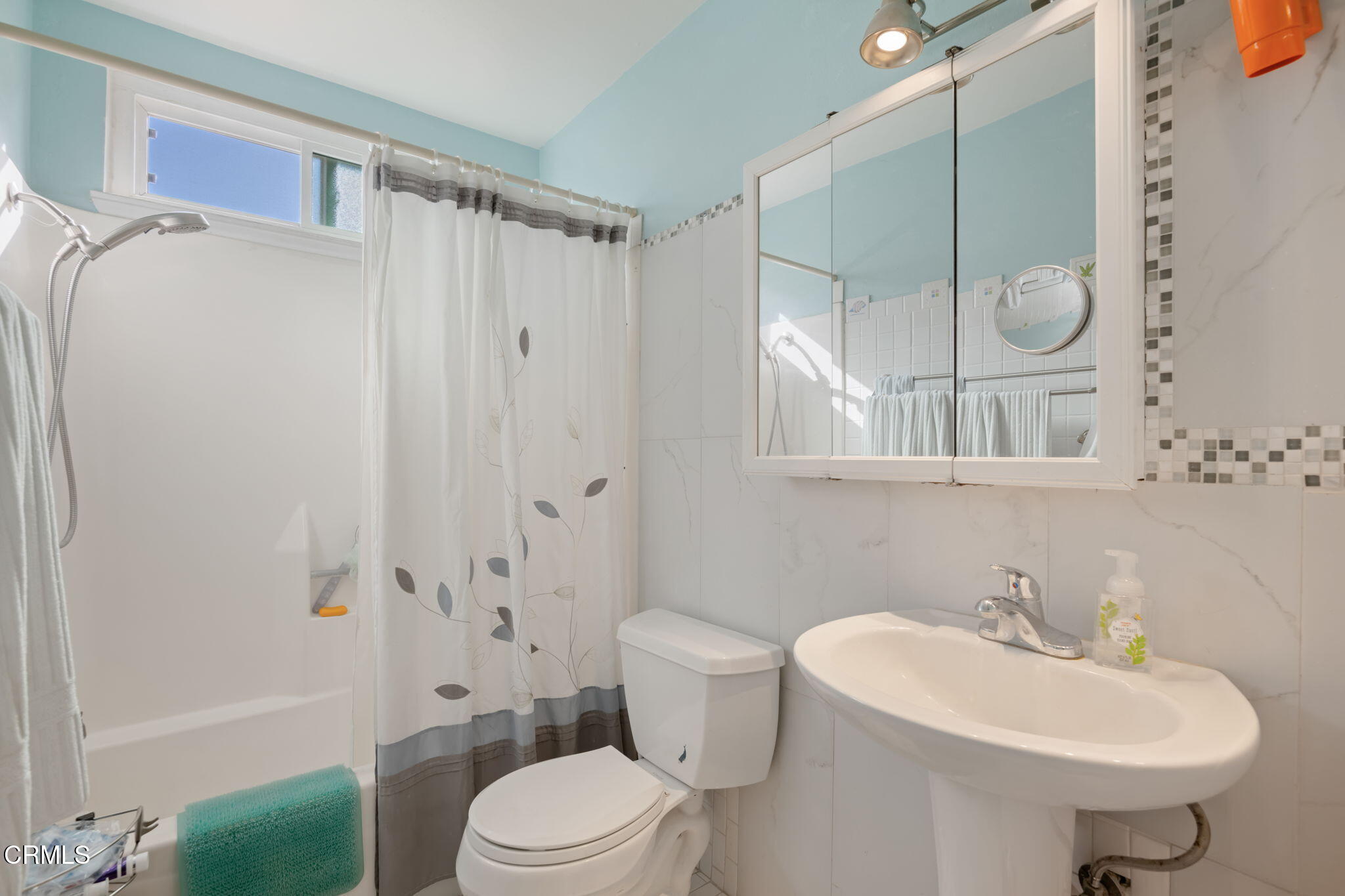 1126 Lawrence Way Oxnard, CA 93035 - Photo 15 of 16 a bathroom with a sink toilet and shower