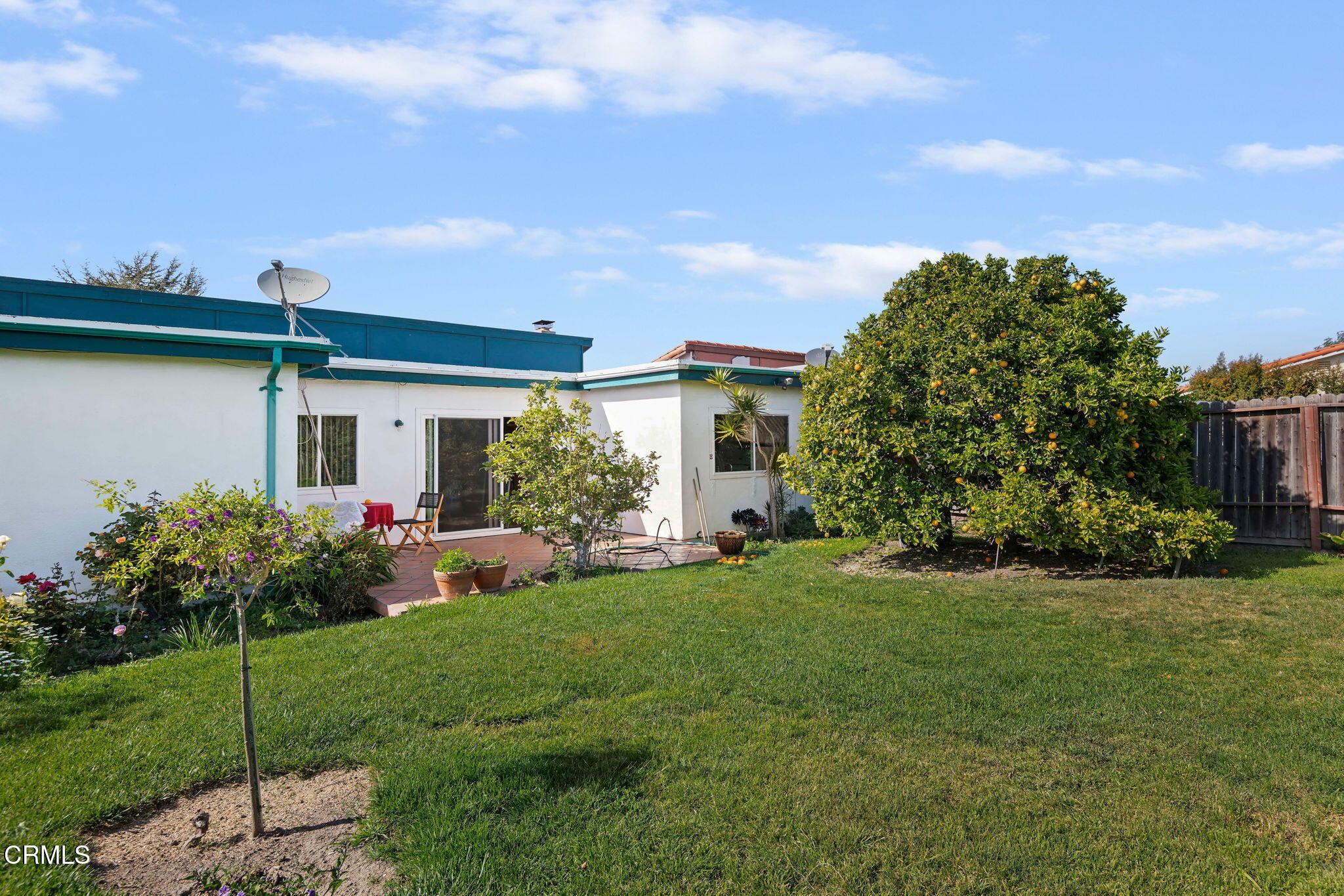 1126 Lawrence Way Oxnard, CA 93035 - Photo 2 of 16 a front view of a house with garden