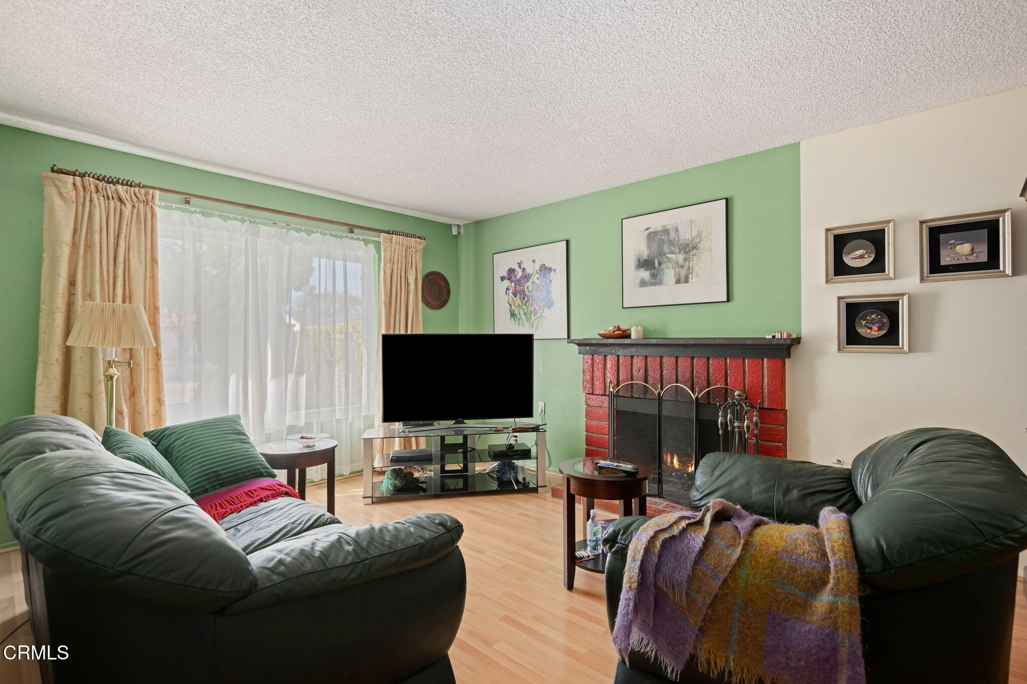 1126 Lawrence Way Oxnard, CA 93035 - Photo 6 of 16 a living room with furniture and a flat screen tv