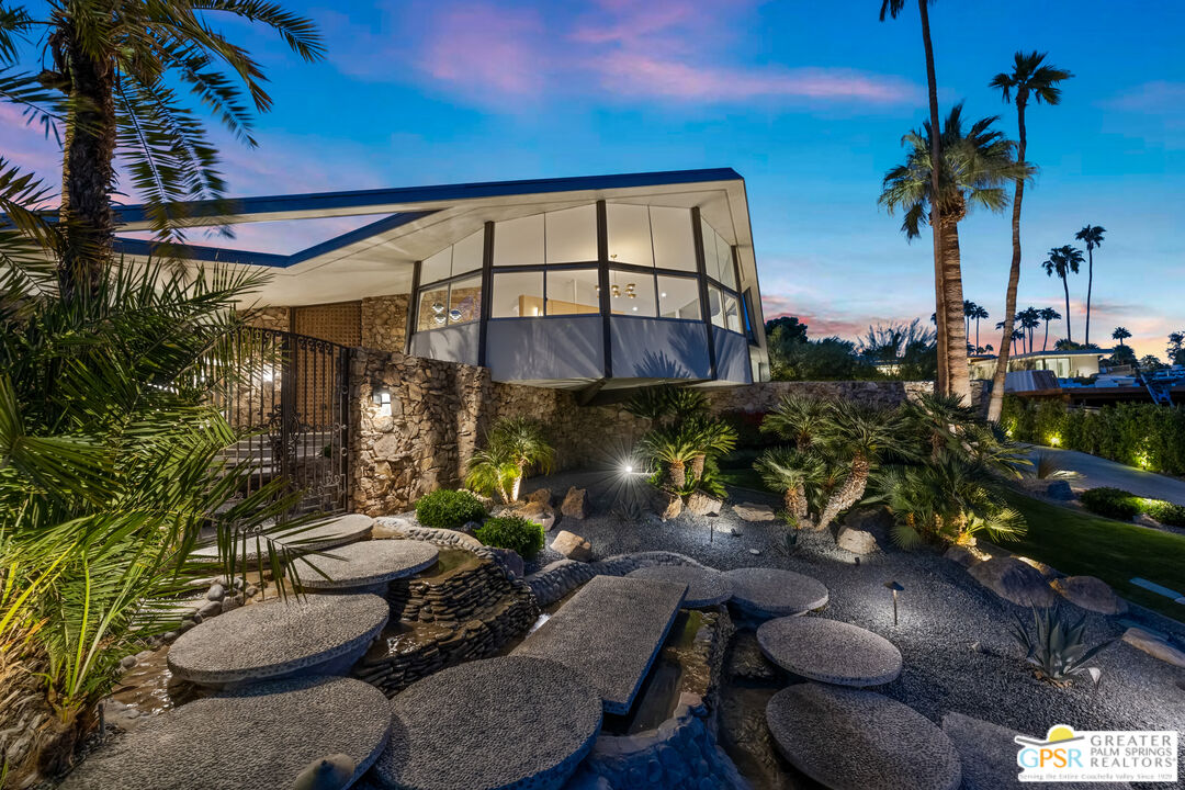 1350 Ladera Circle Palm Springs, CA 92262 - Photo 2 of 10 a view of a patio with table and chairs potted plants and palm tree