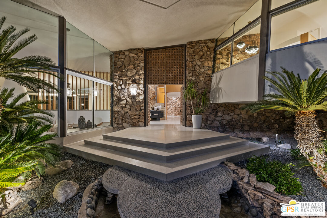 1350 Ladera Circle Palm Springs, CA 92262 - Photo 4 of 10 a view of a backyard with plants and a patio