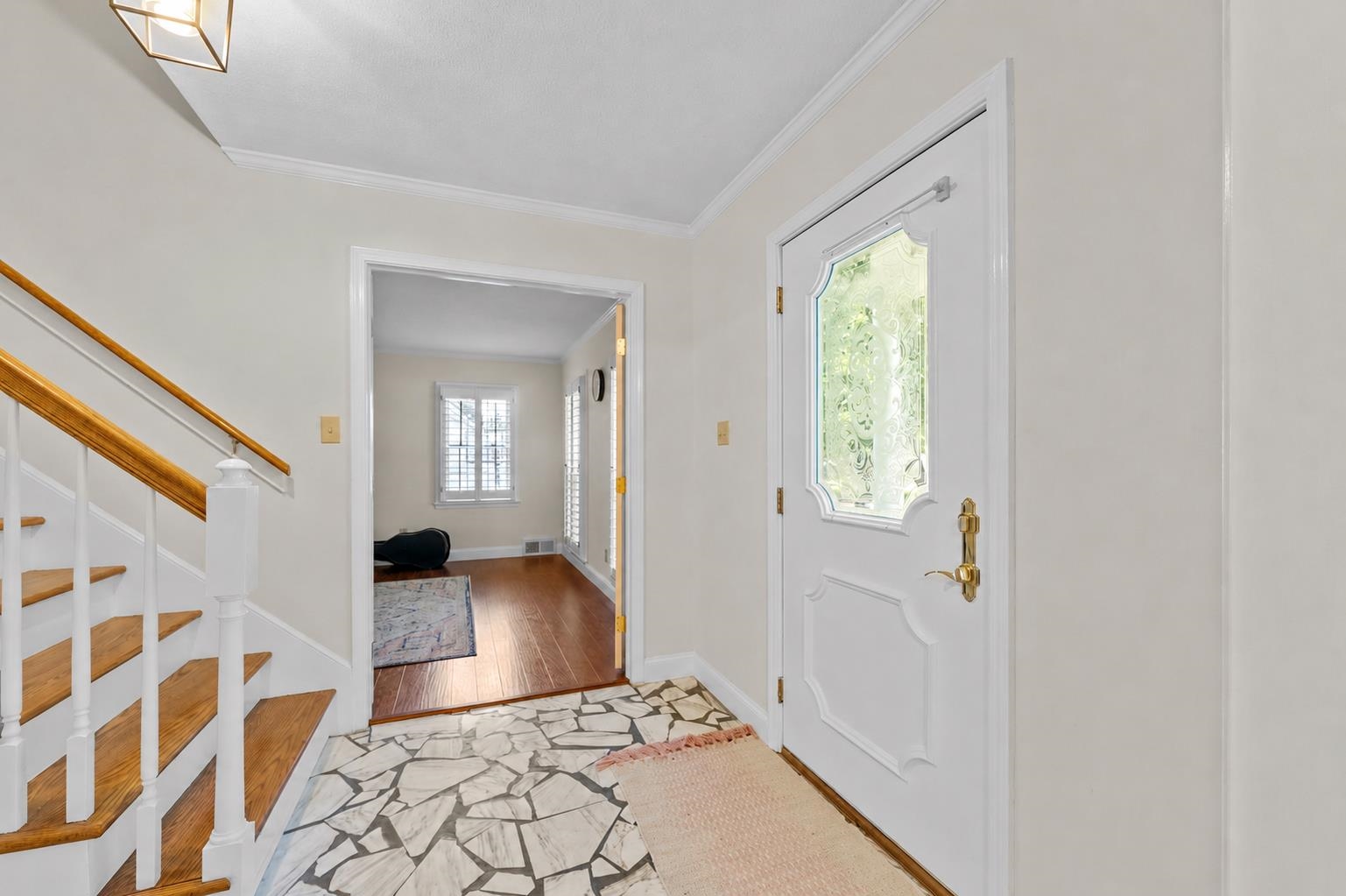 2218 Riverdale Road Germantown, TN 38138 - Photo 3 of 40 Inviting front entry featuring decorative glass front door, hardwood staircase, and a classic layout that creates a warm first impression.