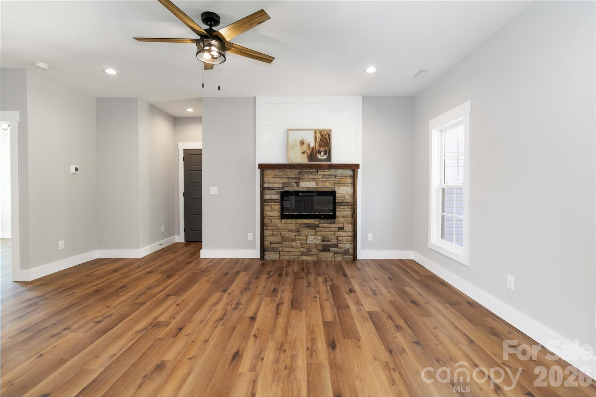 2605 Mt Prospect Road Chester, SC 29706 - Photo 6 of 35 a view of empty room with wooden floor and fireplace