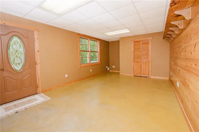 a view of an empty room with a window