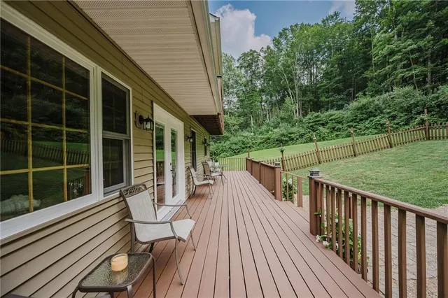a view of balcony with deck and wooden floor
