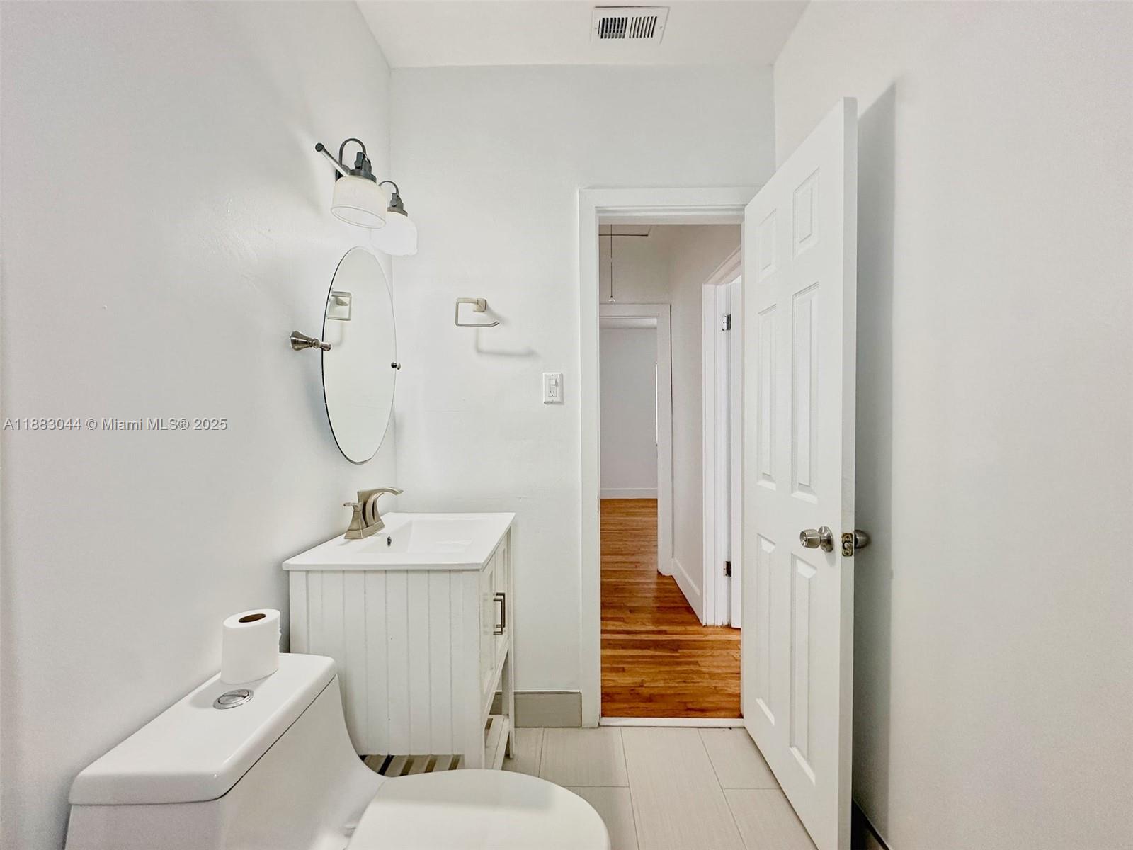 3770 Southwest 27th Street, Unit 3772 Miami, FL 33134 - Photo 11 of 15 a bathroom with a sink toilet and shower
