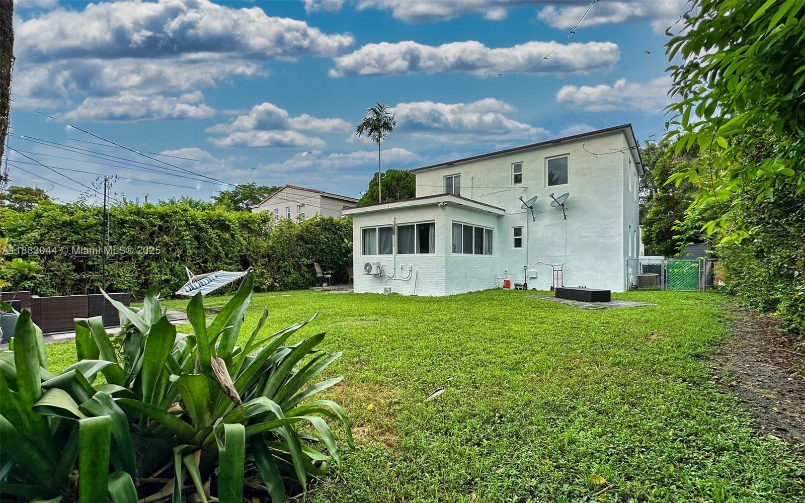 3770 Southwest 27th Street, Unit 3772 Miami, FL 33134 - Photo 13 of 15 a view of a house with a yard