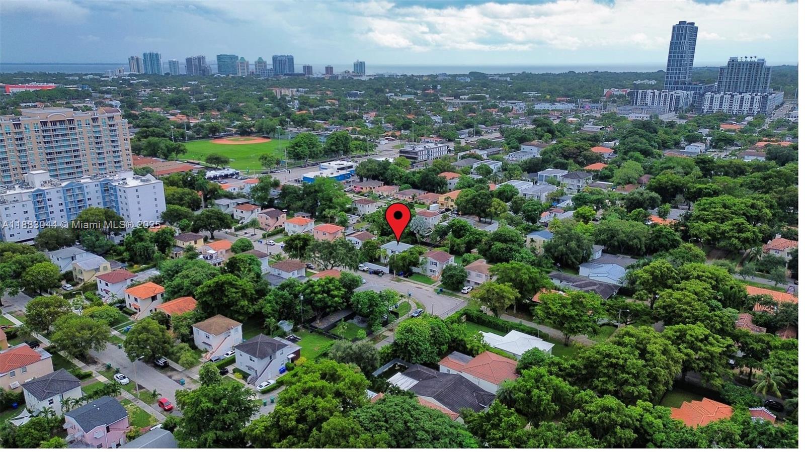 3770 Southwest 27th Street, Unit 3772 Miami, FL 33134 - Photo 14 of 15 an aerial view of residential houses with city view