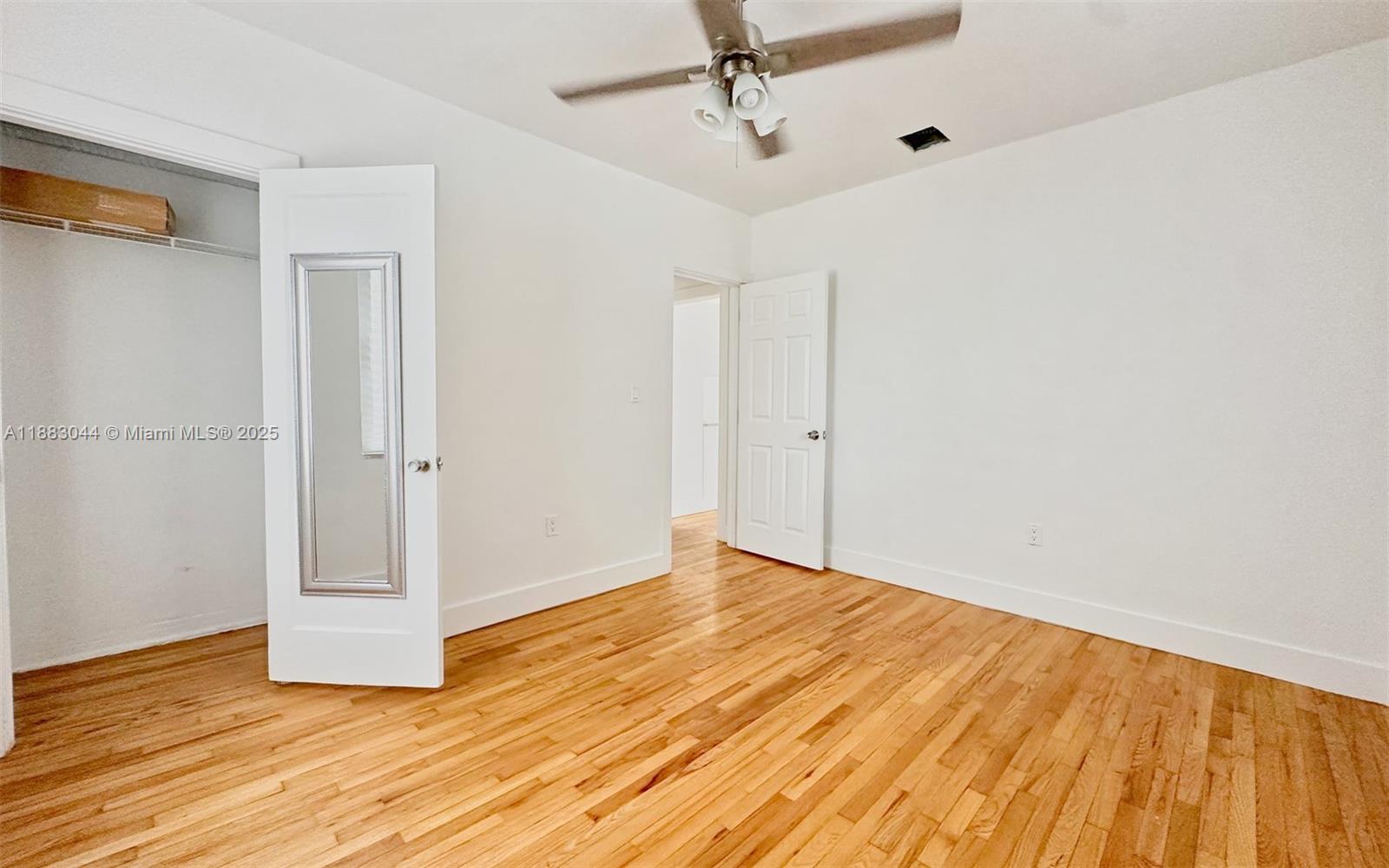 3770 Southwest 27th Street, Unit 3772 Miami, FL 33134 - Photo 9 of 15 wooden floor in an empty room