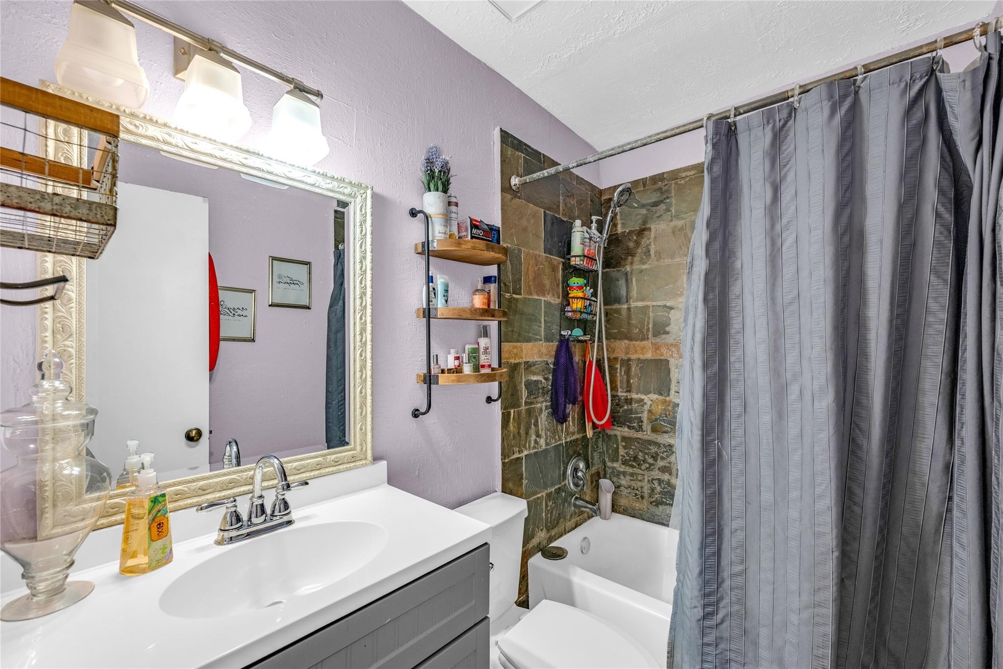 24014 Red Sky Drive Spring, TX 77373 - Photo 5 of 23 a bathroom with a sink vanity mirror and shower