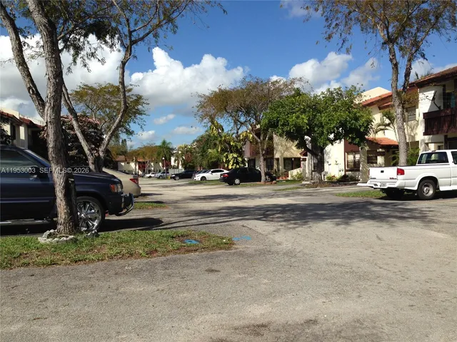 a close view of a sink a window and refrigerator