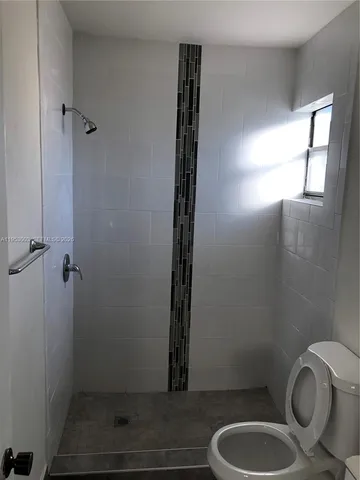 a bathroom with a toilet and a sink