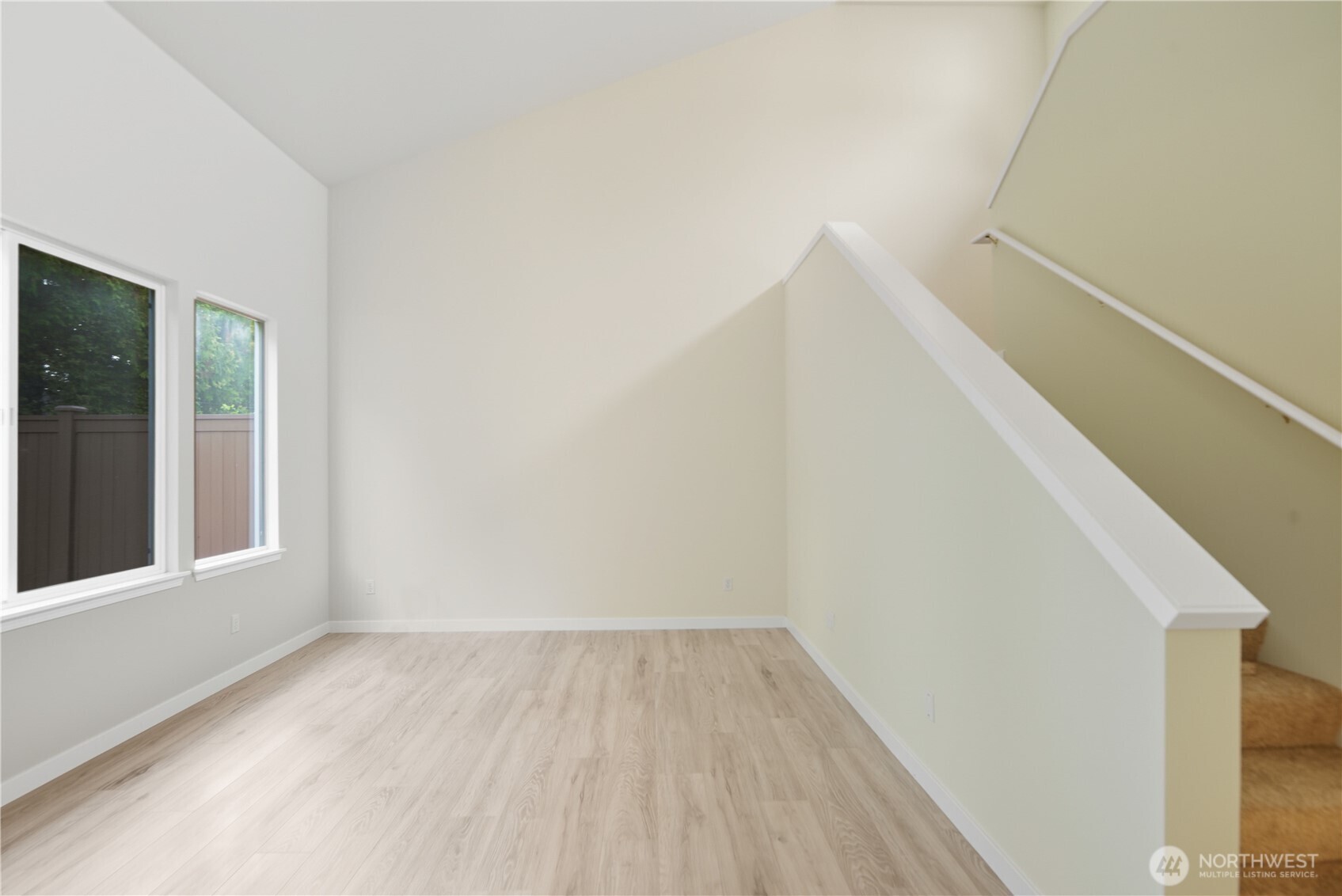 1430 West Casino Road, Unit 272 Everett, WA 98204 - Photo 11 of 37 a view of a room that has wooden floor and white walls
