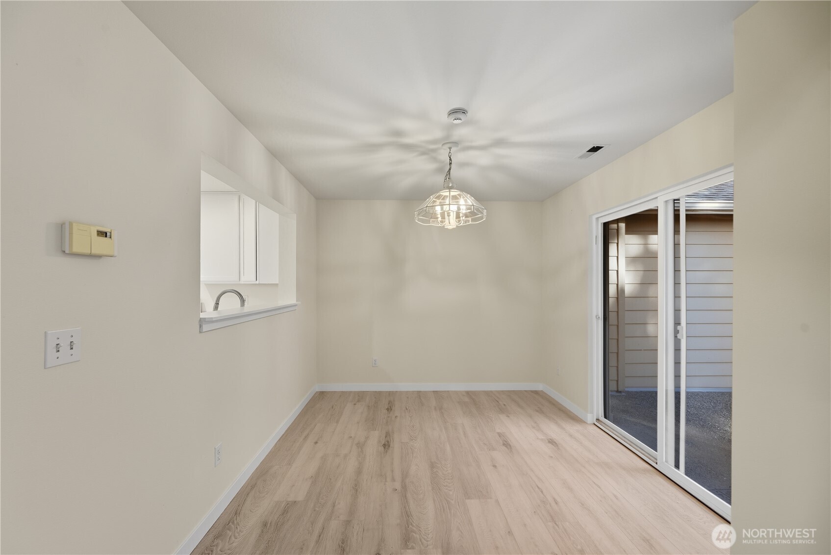 1430 West Casino Road, Unit 272 Everett, WA 98204 - Photo 13 of 37 wooden floor in an empty room with a window