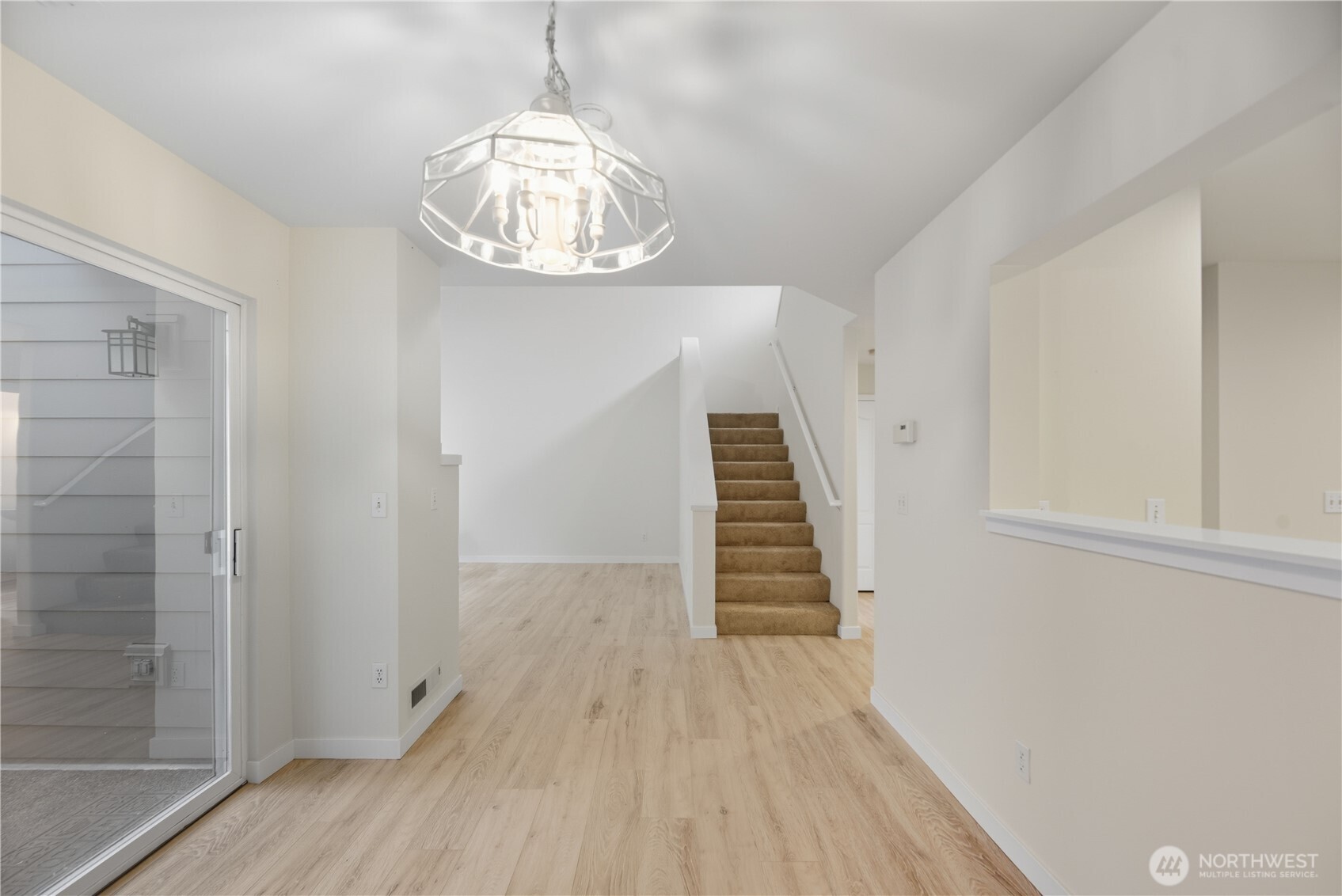 1430 West Casino Road, Unit 272 Everett, WA 98204 - Photo 19 of 37 a view of a hallway with wooden floor and staircase