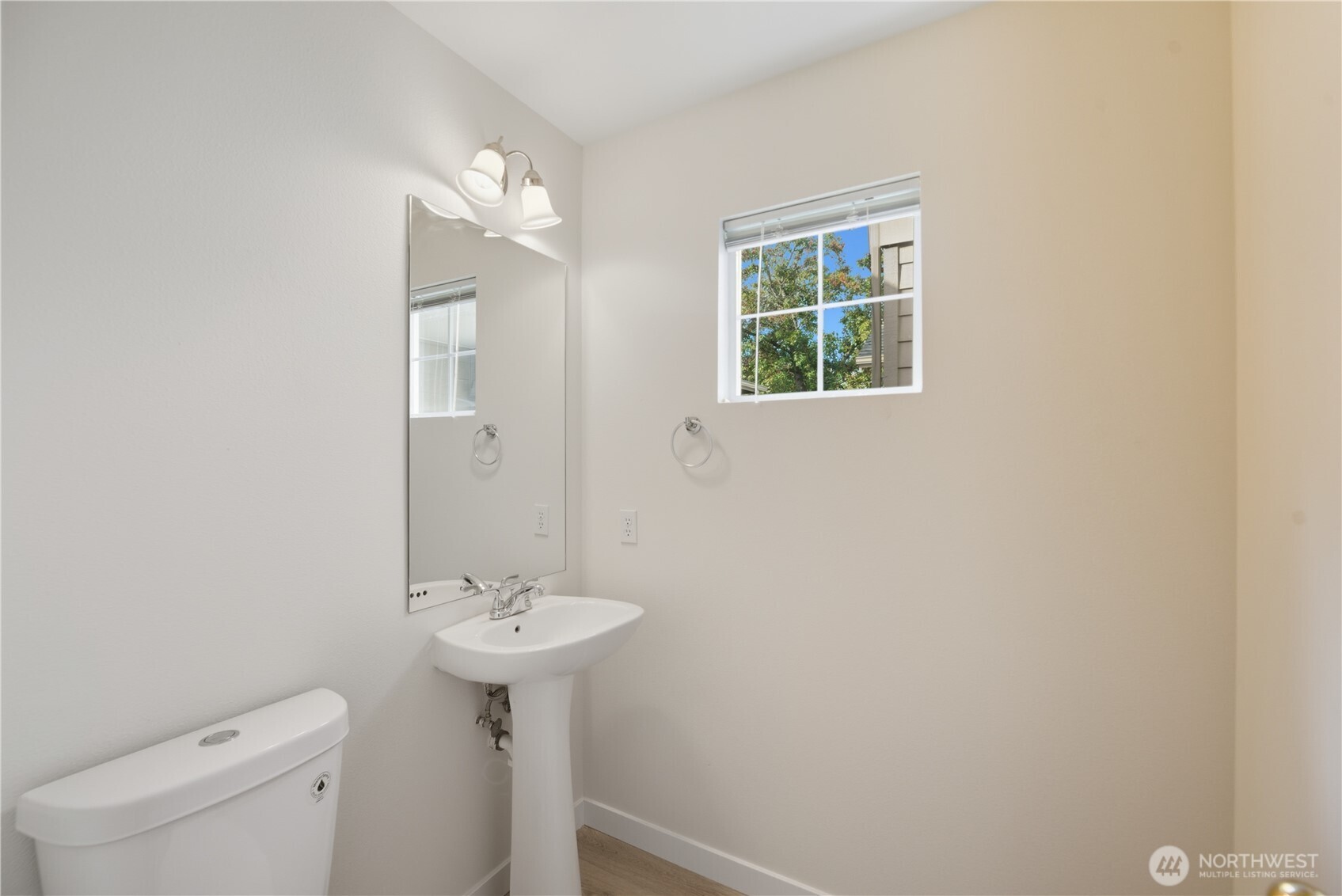 1430 West Casino Road, Unit 272 Everett, WA 98204 - Photo 20 of 37 a bathroom with a sink a toilet and a window