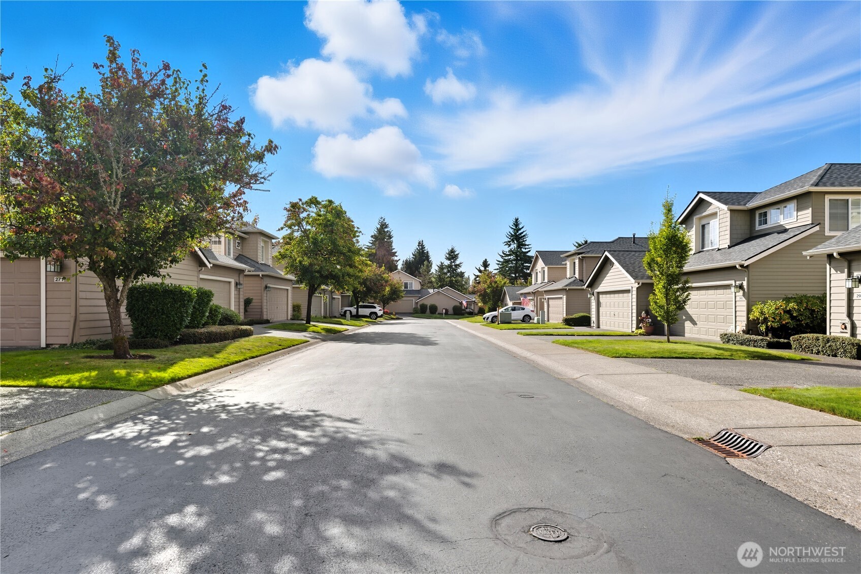 1430 West Casino Road, Unit 272 Everett, WA 98204 - Photo 35 of 37 a front view of a house with a yard and garage