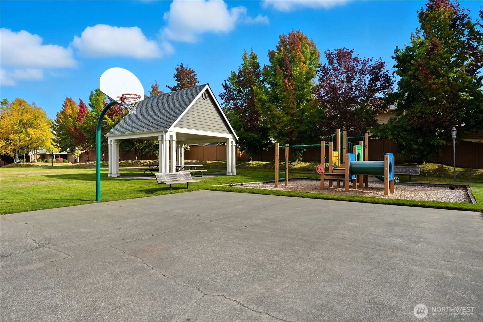 1430 West Casino Road, Unit 272 Everett, WA 98204 - Photo 37 of 37 a view of a house with a swimming pool and a yard