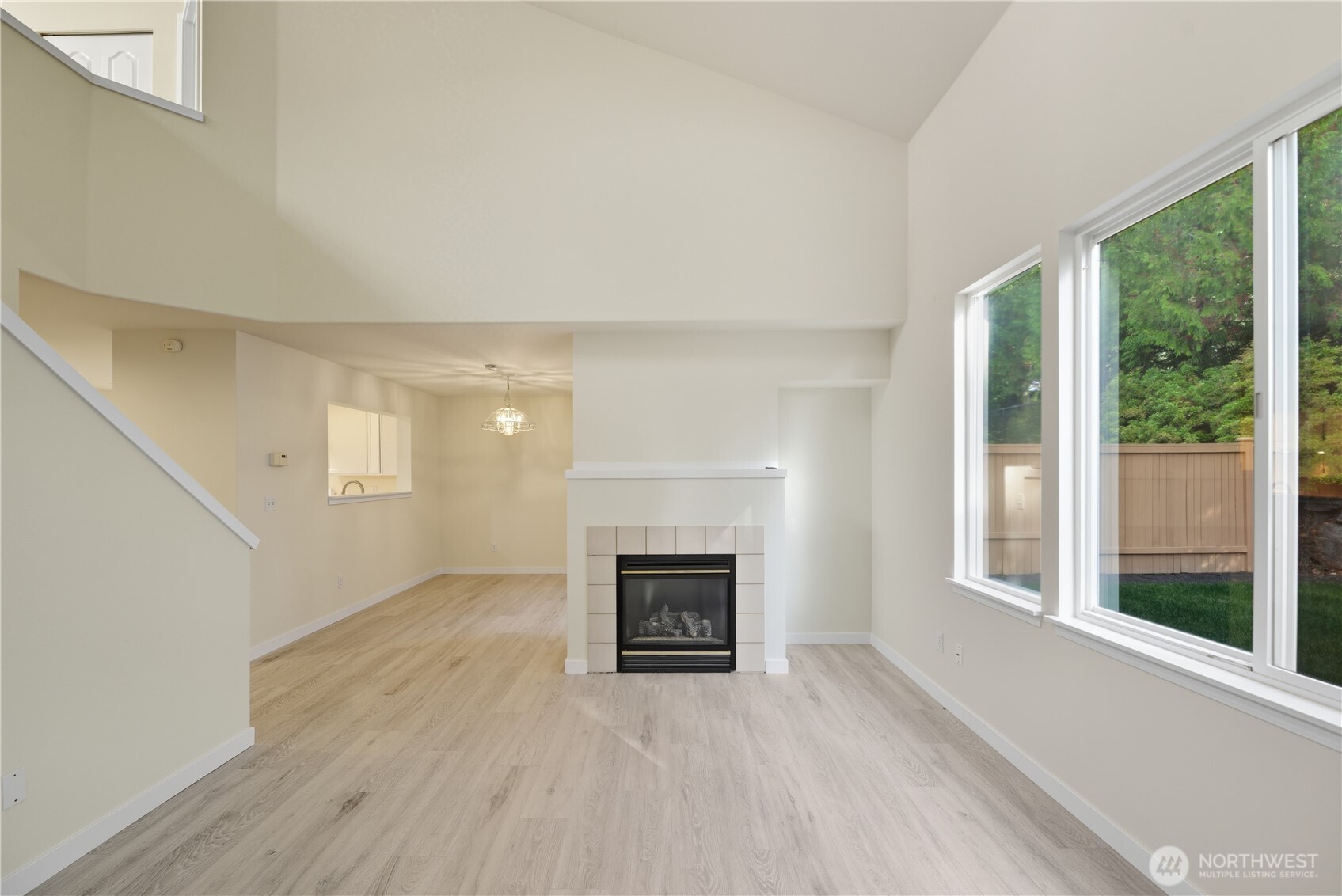 1430 West Casino Road, Unit 272 Everett, WA 98204 - Photo 9 of 37 a view of an empty room with a fireplace and a window