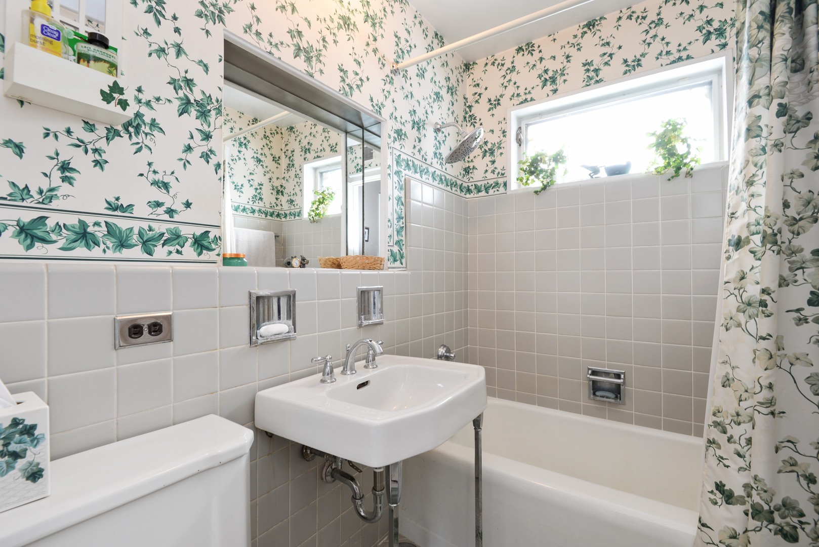 3225 Illinois Road Wilmette, IL 60091 - Photo 16 of 21 a bathroom with a sink a toilet and shower