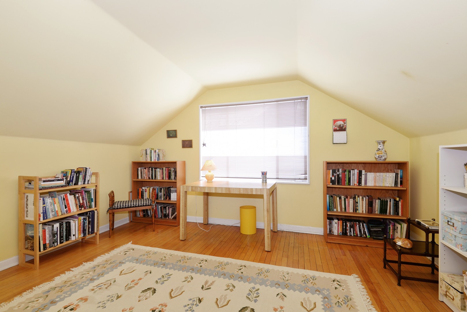 3225 Illinois Road Wilmette, IL 60091 - Photo 18 of 21 a living room with couch and a book shelf