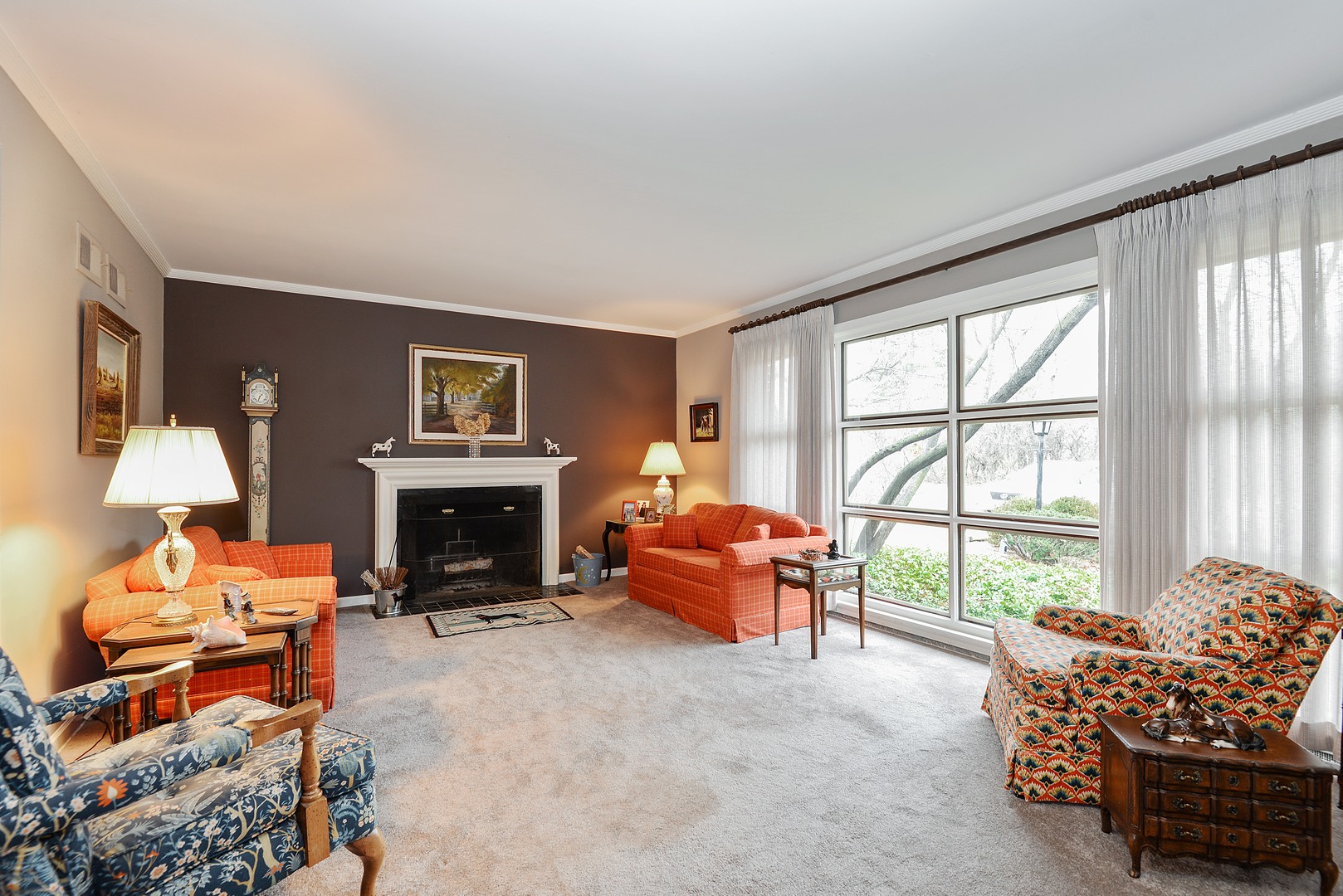 3225 Illinois Road Wilmette, IL 60091 - Photo 5 of 21 a living room with furniture and a fireplace