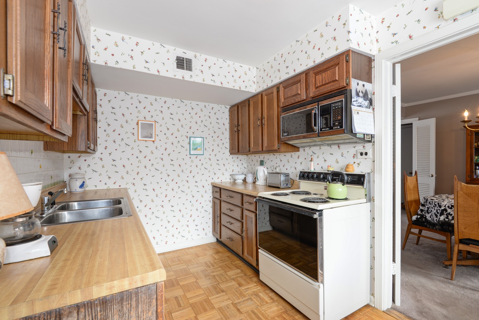 3225 Illinois Road Wilmette, IL 60091 - Photo 10 of 21 a kitchen with stainless steel appliances granite countertop a stove and a microwave