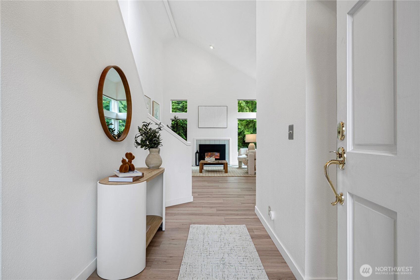 a view of living room with furniture and a fireplace