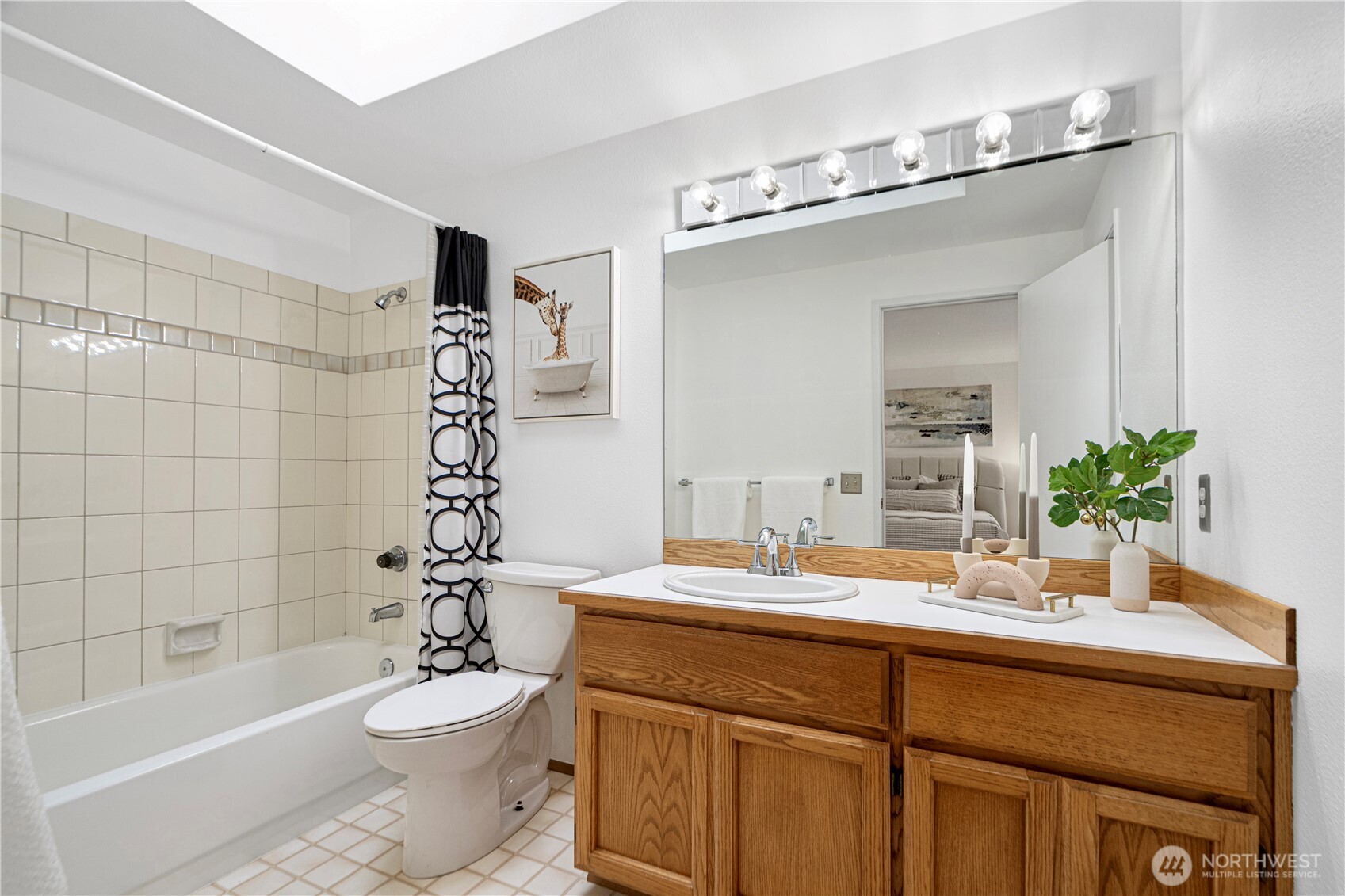 11719 Northeast 166th Court Bothell, WA 98011 - Photo 17 of 27 a bathroom with a sink a toilet a mirror and shower