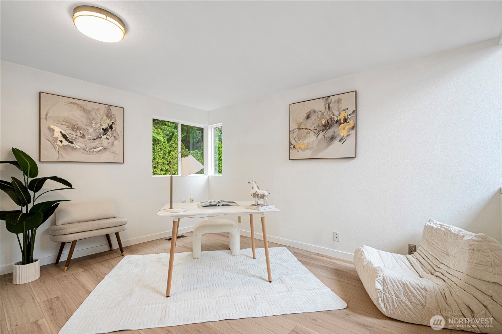 11719 Northeast 166th Court Bothell, WA 98011 - Photo 18 of 27 a living room with furniture and a potted plant
