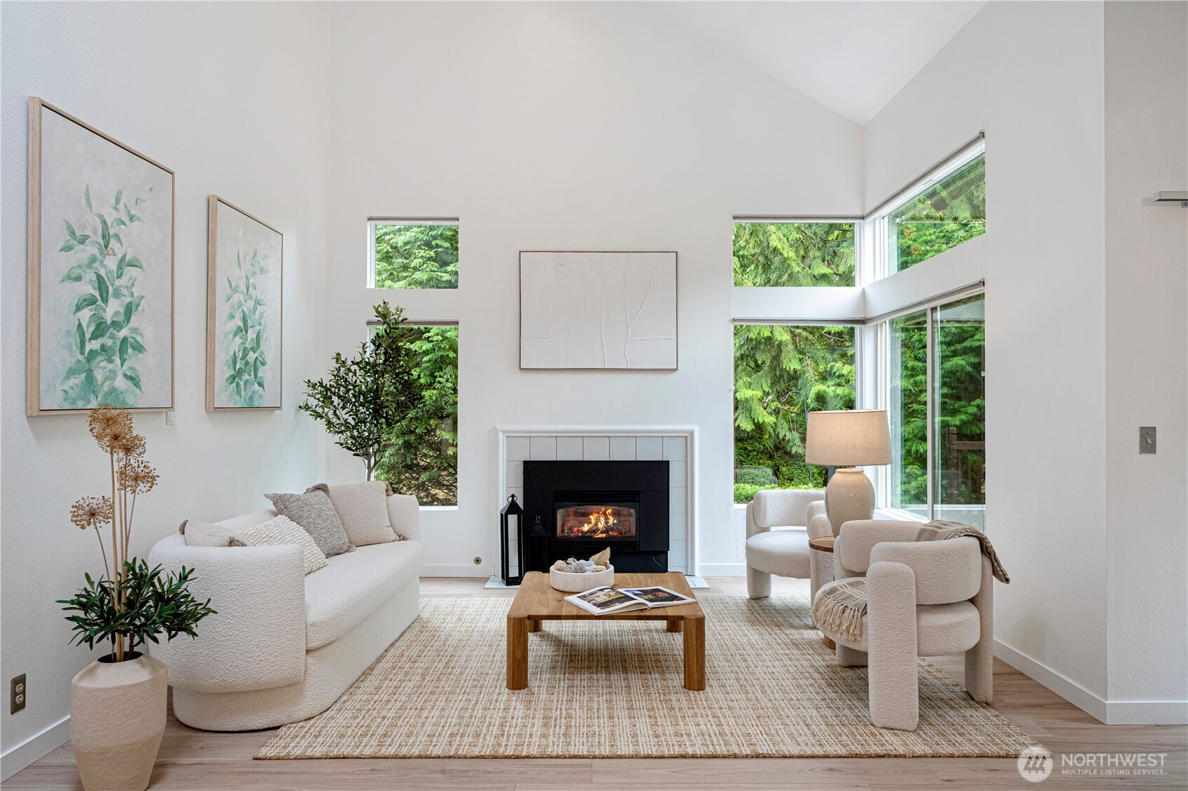 11719 Northeast 166th Court Bothell, WA 98011 - Photo 2 of 27 a living room with furniture large window and a fireplace