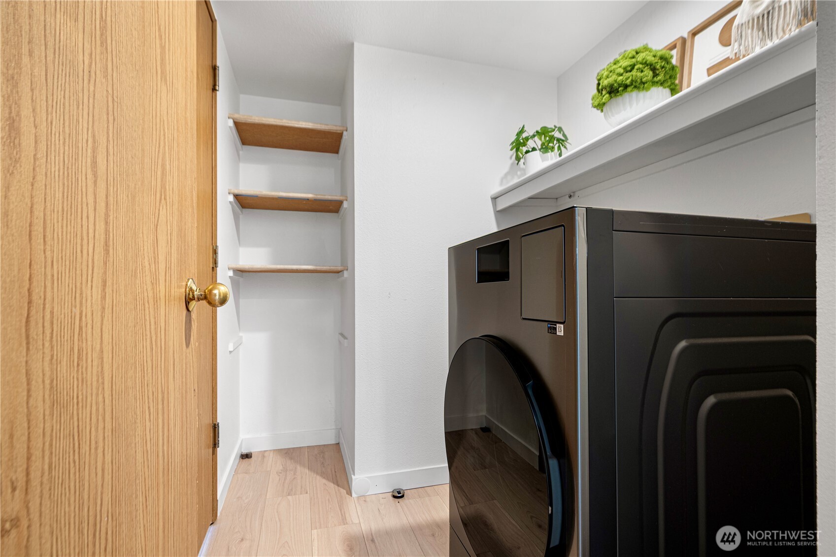 11719 Northeast 166th Court Bothell, WA 98011 - Photo 21 of 27 a view of walk in closet with clothes and shoes