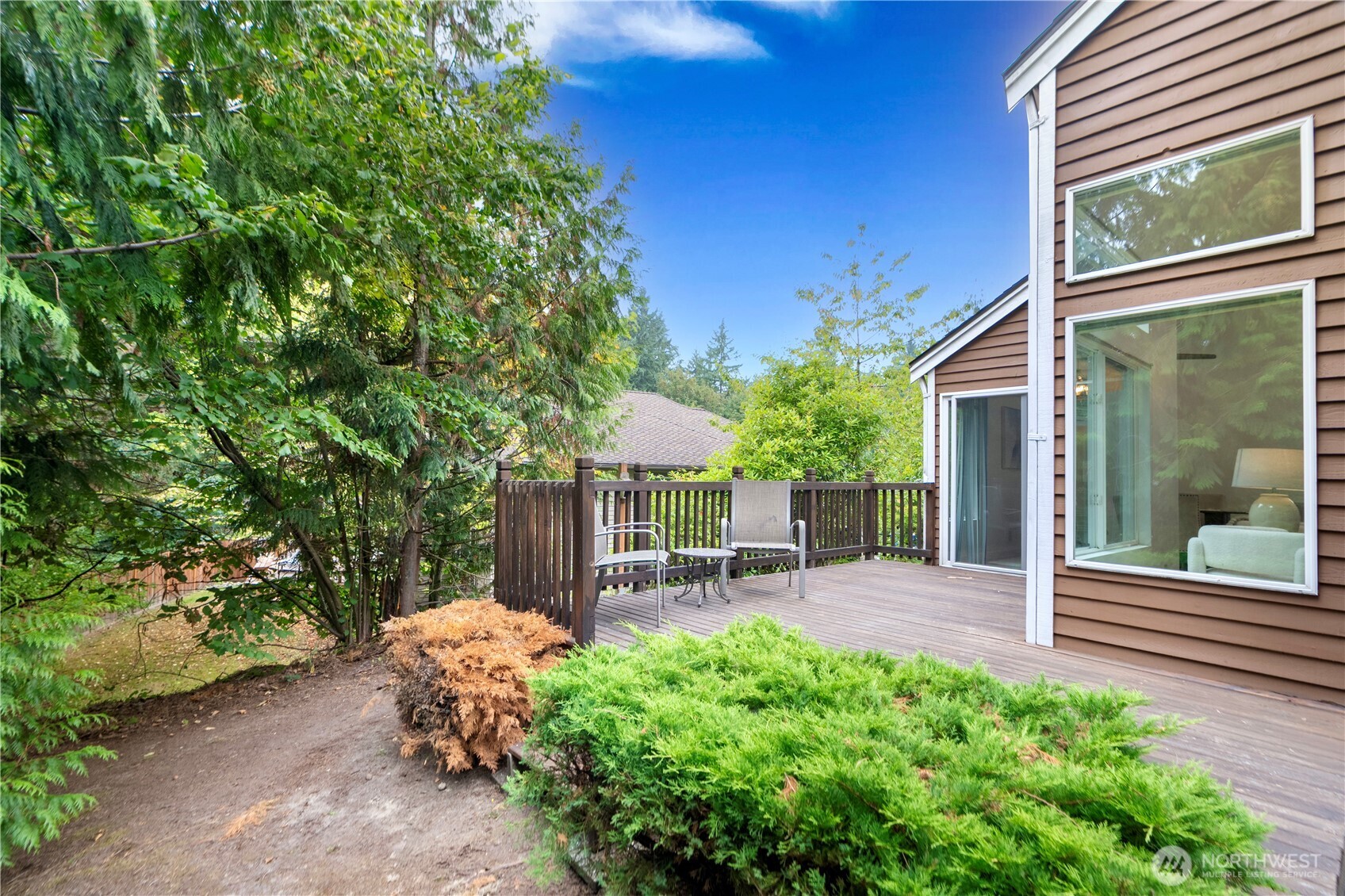 11719 Northeast 166th Court Bothell, WA 98011 - Photo 25 of 27 a view of a chair and table in backyard of the house