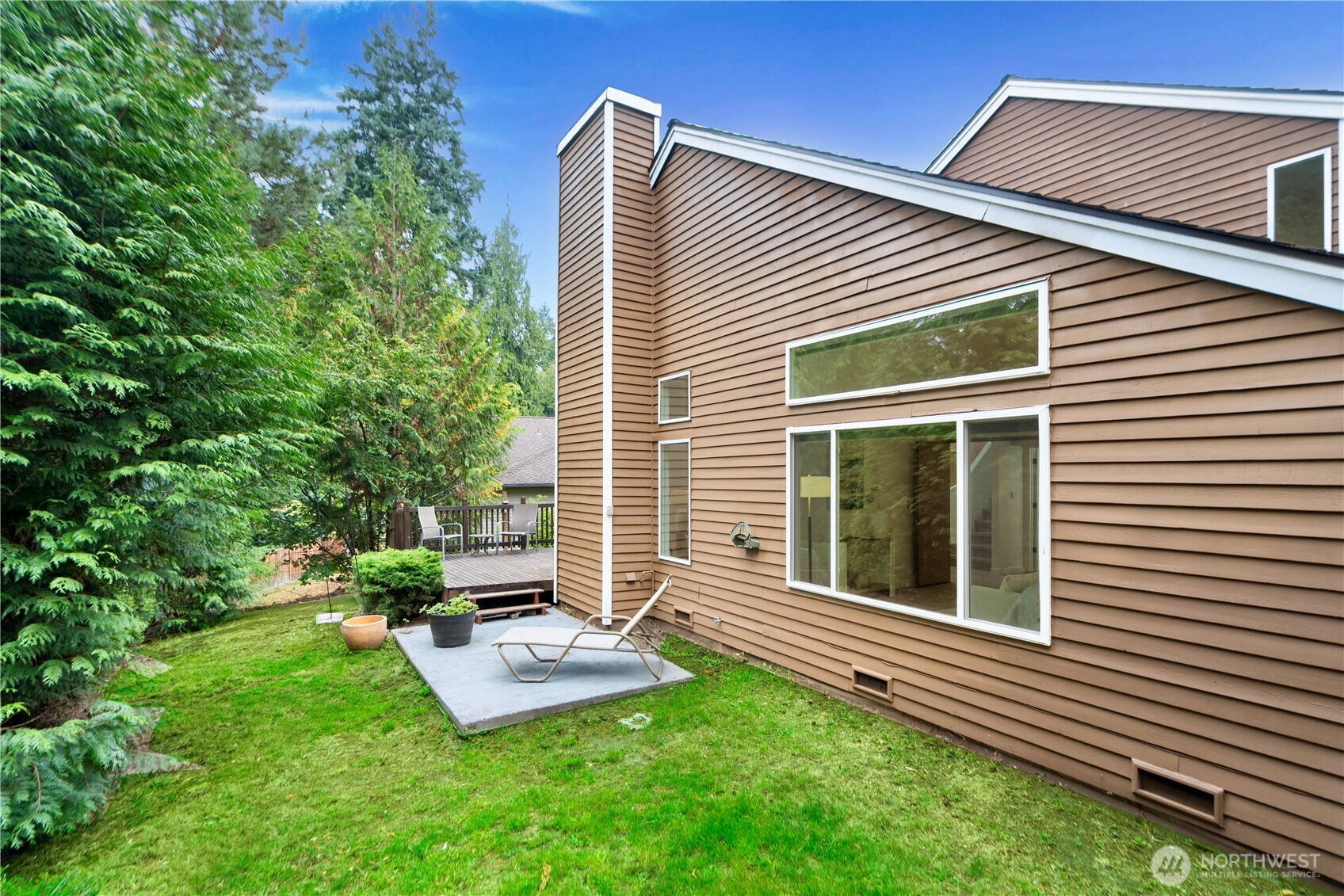11719 Northeast 166th Court Bothell, WA 98011 - Photo 26 of 27 a backyard of a house with seating space