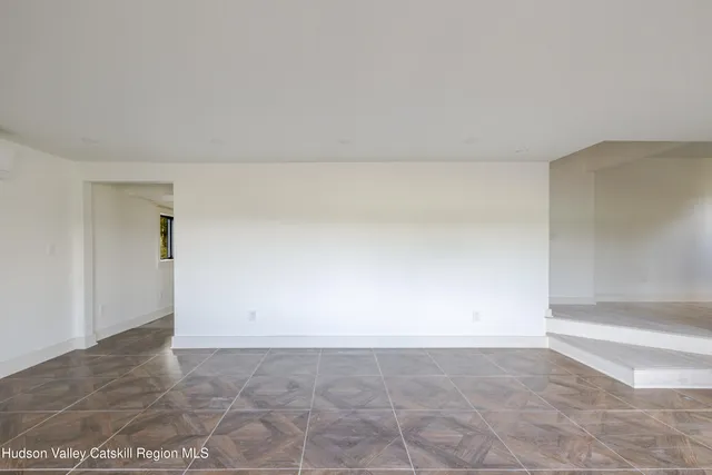 a bathroom with a double vanity sink mirror and shower