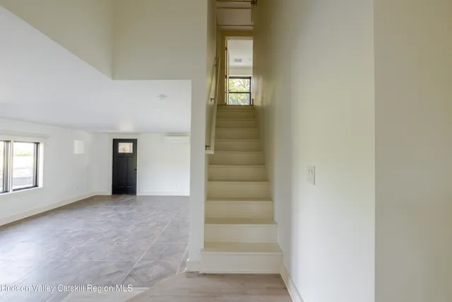 a spacious bathroom with a granite countertop sink a toilet and shower