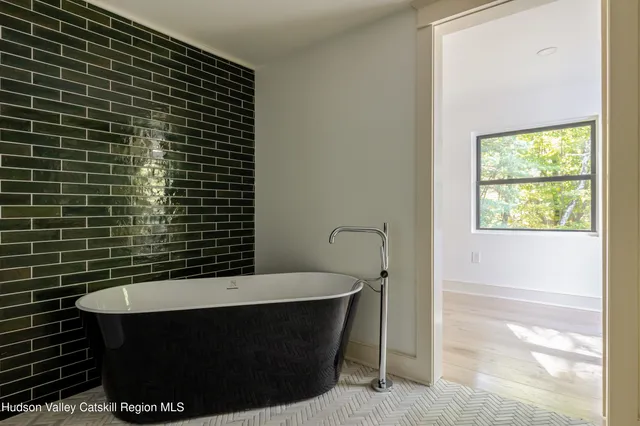 a bathroom with a sink a vanity and a mirror