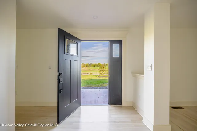 a kitchen with granite countertop a sink stove and cabinets