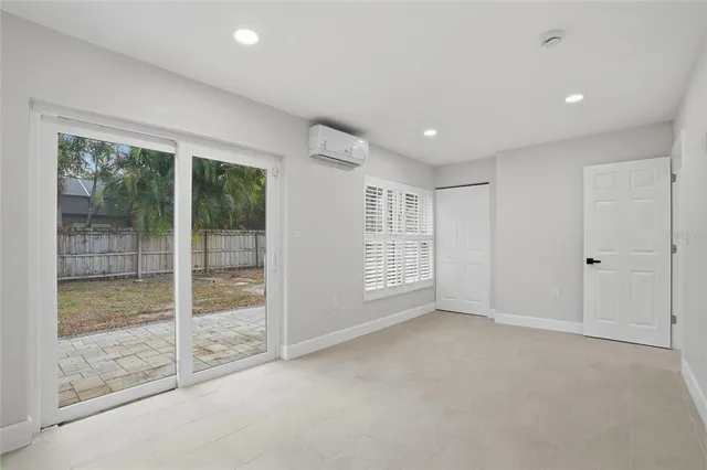 a view of an empty room with glass door
